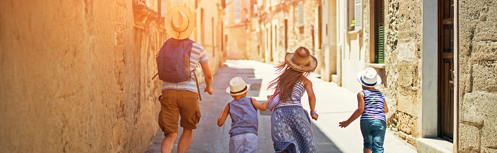 family running up streets in Europe