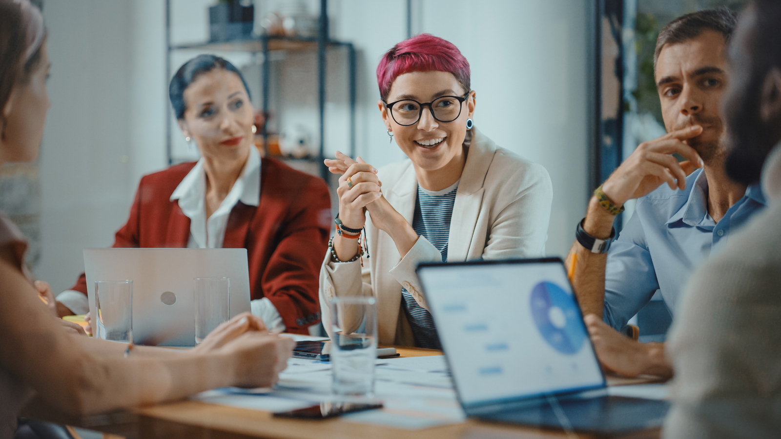 Workers discuss in the office