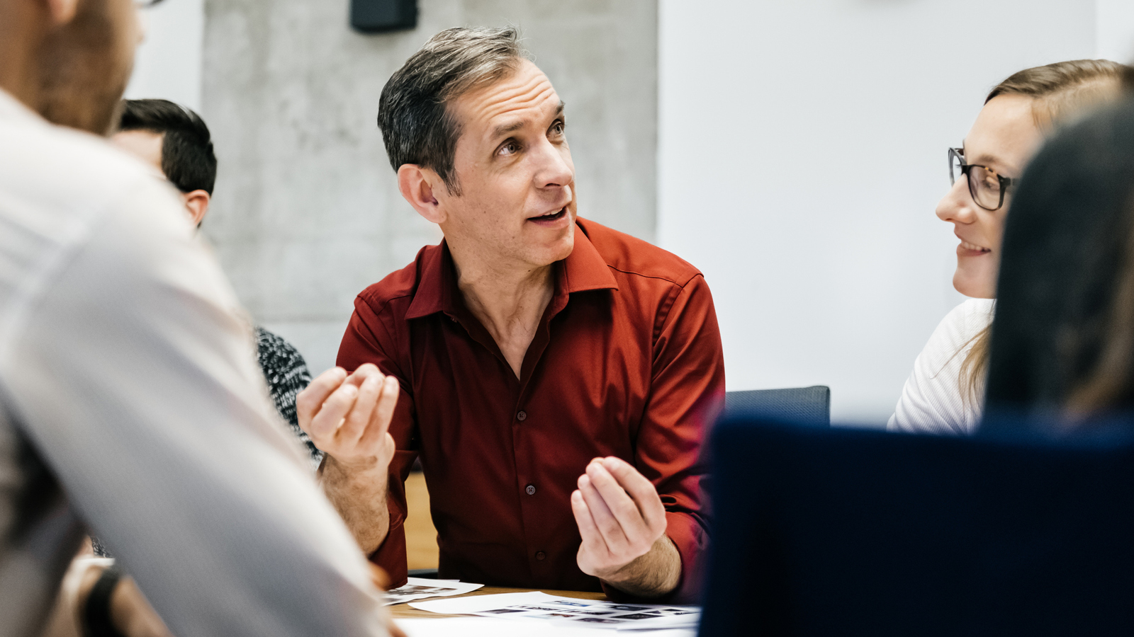 A man talks during a discuss at work