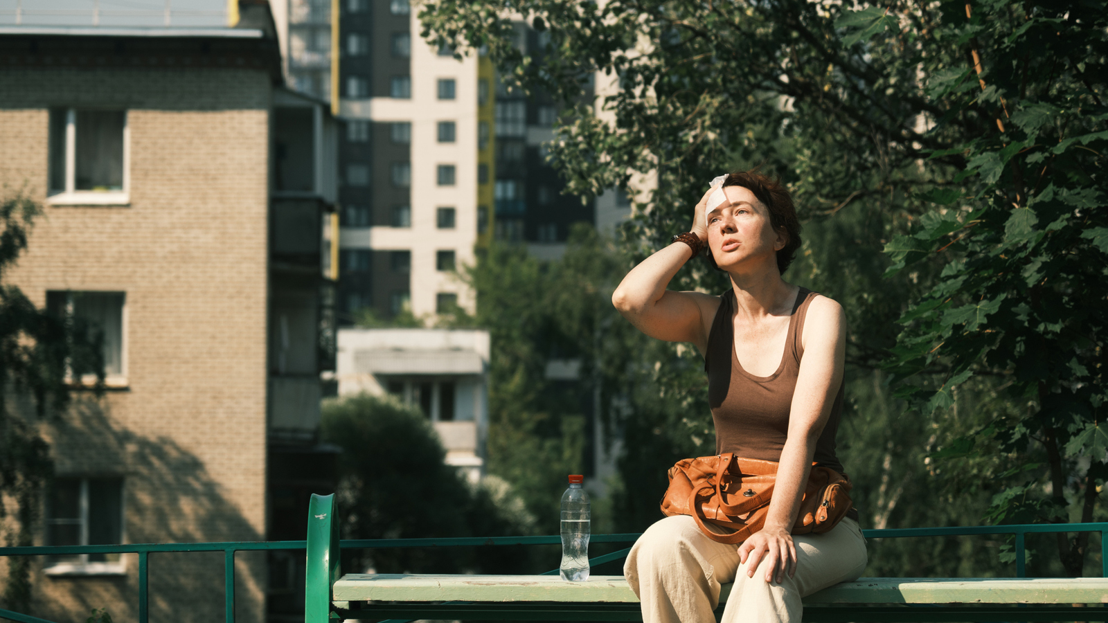 a woman sweats in the sun