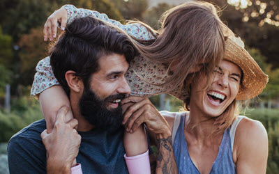 Southern Cross Health Insurance plans mobile banner A young couple together with their daughter who is sat on her dad's shoulders