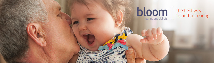 bloom hearing specialists - Southern Cross member offer A man hugging and kissing a baby