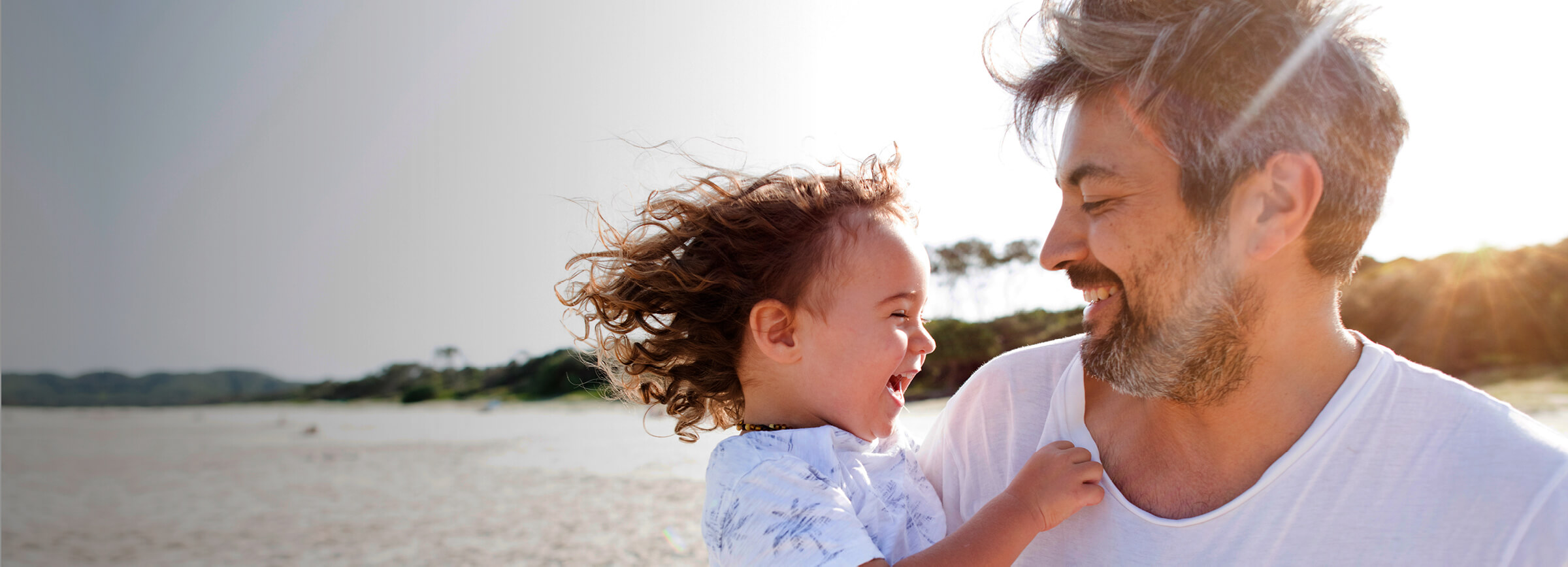 A father and child at the beach