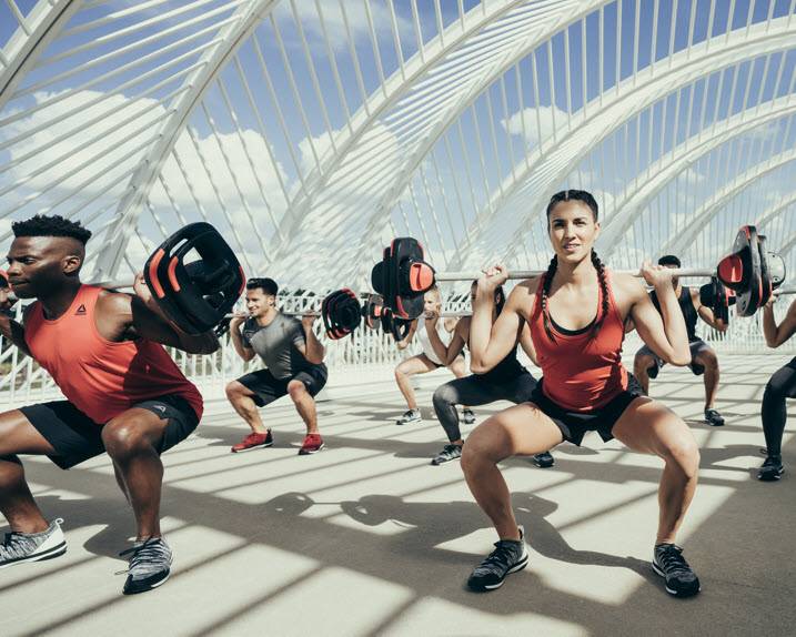 A group of people working out with weights